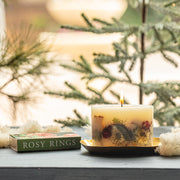 Petite botanical candle styled on gold plate