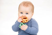 Baby playing with Stack N Chew Earthy