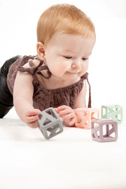 Baby playing with Stack N Chew Pastel