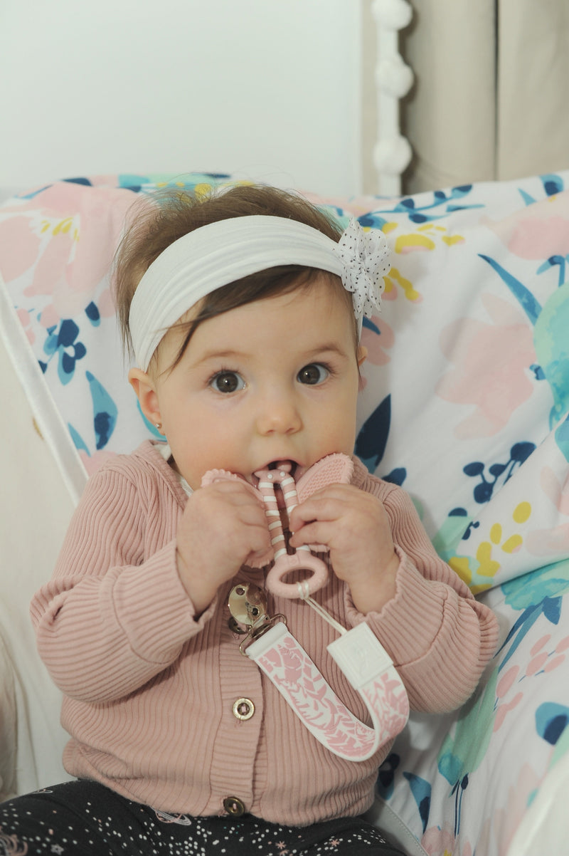 Baby using Butterfly Brush teether