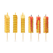 Hot & Crispy french fry candles lit on a birthday cake