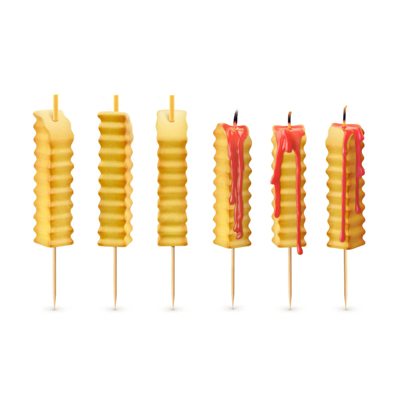 Hot & Crispy french fry candles lit on a birthday cake